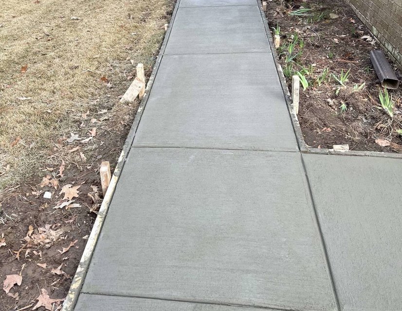 Concreate sidewalk along a house in Iroquois Ontario