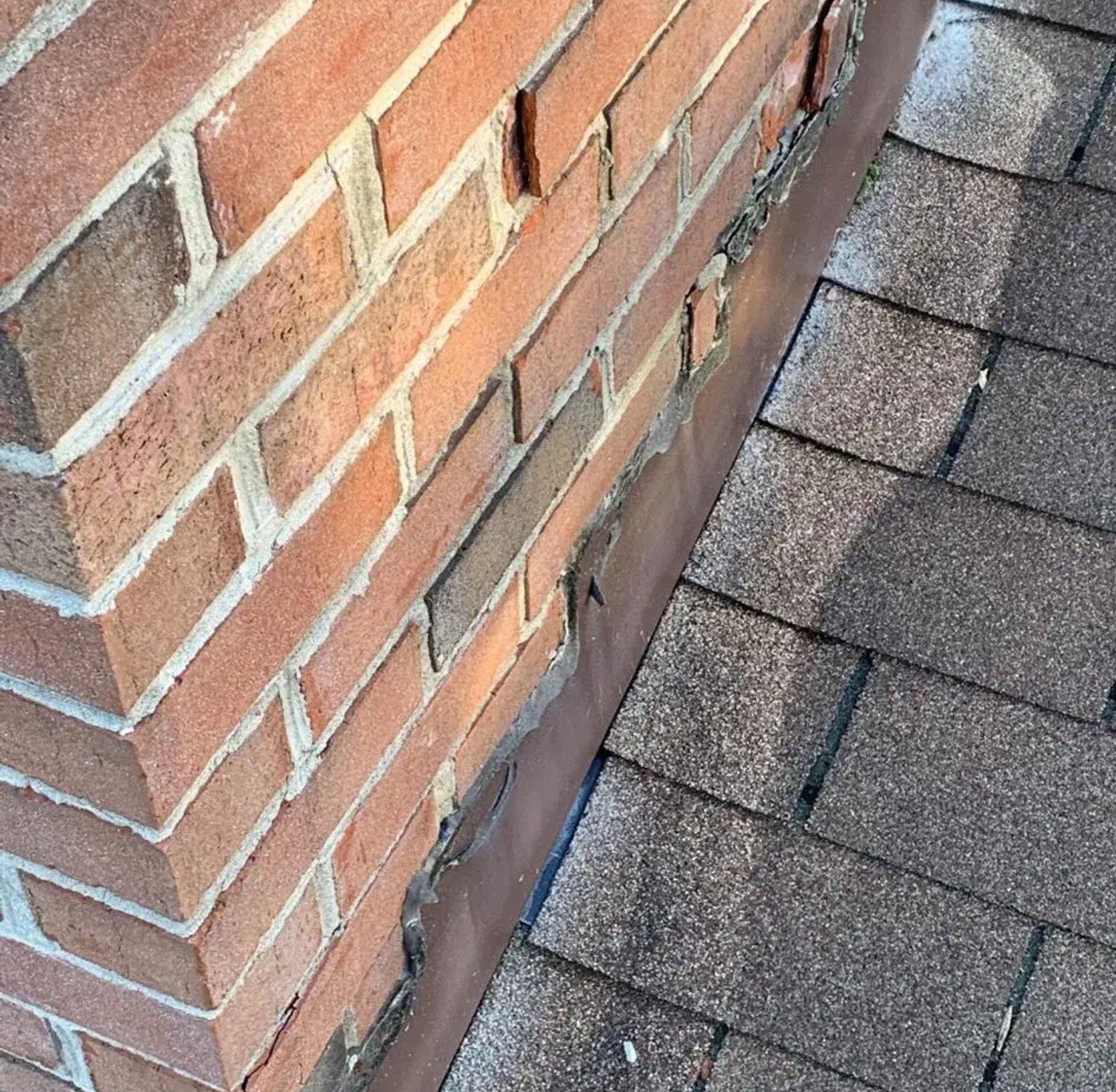 crumbling chimney made of brick from 1960's